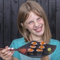Pretty teen girl with sushi roll , teenage girl eating japanese sushi
