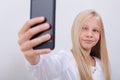 Pretty teen girl taking selfies with her smart Royalty Free Stock Photo