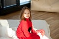 pretty teen girl waking up and sitting on the bed at home Royalty Free Stock Photo