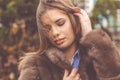 Pretty teen girl is wearing fur coat Royalty Free Stock Photo