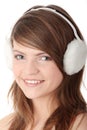 Pretty teen girl wearing white earmuff Royalty Free Stock Photo