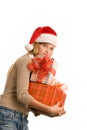 Pretty teenage girl holding pile of gifts