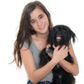 Pretty teenage girl hugging her pet dog Royalty Free Stock Photo