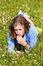 Pretty teenage girl lying in grass Royalty Free Stock Photo