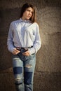 Pretty teenage girl in a shirt and jeans