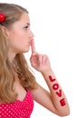 Pretty teenage girl showing silence sign