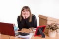 Pretty teenage girl sitting at office desk Royalty Free Stock Photo