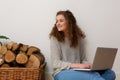 Pretty teenage girl smiling with laptop at home Royalty Free Stock Photo