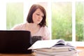 Pretty teenage girl studying at home Royalty Free Stock Photo