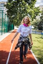 Pretty Teenage Girl Wearing Roller Skaters On The Road In Summe Park.