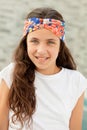 Pretty teenager girl with a flowered headband Royalty Free Stock Photo