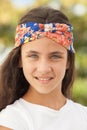 Pretty teenager girl with a flowered headband Royalty Free Stock Photo