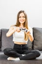 Lovely Girl Plays Video Game Royalty Free Stock Photo