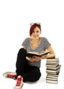 Pretty teenager girl sit on floor and reading book Royalty Free Stock Photo