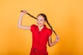 Pretty teenager girl smiling on camera looking cheerful on yellow background. Positive emotions Royalty Free Stock Photo