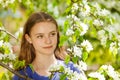 Pretty teenager girl with white pear flowers Royalty Free Stock Photo