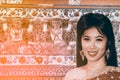 The pretty Thai lady in Middle Thai classical traditional dress suit standing and is posing in Thai temple. Royalty Free Stock Photo