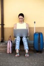 Pretty travelling woman consulting a travel destination for your