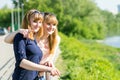 Pretty twins girls having fun looking away