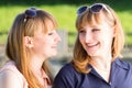 Pretty twins girls having fun at outdoor summer park Royalty Free Stock Photo