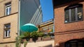 Pretty Urban Balcony with Round Green Umbrella in Heidelberg Germany