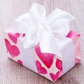 Pretty Valentines gift with hearts on the giftwrap