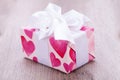 Pretty Valentines gift with hearts on the giftwrap