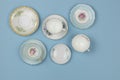 Pretty vintage china teacups on bue background Royalty Free Stock Photo