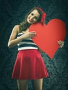 Pretty vintage woman holding a huge heart Royalty Free Stock Photo