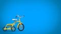 Pretty vintage yellow tricycle - blue background