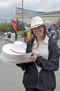 Pretty volunteer with white cowboy hats