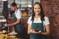 Pretty waitress holding a plate with muffin Royalty Free Stock Photo