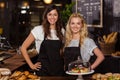 Pretty waitresses behind the counter Royalty Free Stock Photo