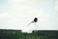 Pretty wedding girl on green grass and sky Royalty Free Stock Photo