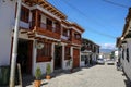 Pretty white two story houses with wooden balconies, historic town Villa de Leyva, Colombia