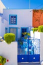 Pretty white villa with blue door Pyrgos Kallistis Santorini Greece Royalty Free Stock Photo
