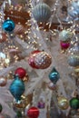 Pretty window filled with the bright colors of holiday ornaments Royalty Free Stock Photo