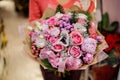 Pretty winter bouquet of beautiful flowers in woman hands