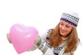 Pretty winter dressed teenage girl with pink heart