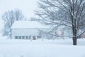 Pretty winter early morning landscape with large white wooden barn in field Royalty Free Stock Photo