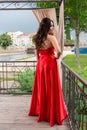 Grace and Style: High School Graduate Posing on Garden Balcony Royalty Free Stock Photo