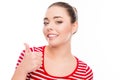 Pretty woman with beaming smile showing thumb up Royalty Free Stock Photo