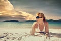 A pretty woman in bikini sunbathing at the beach on a background Royalty Free Stock Photo