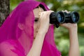 Pretty woman with binoculars.