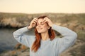 pretty woman in blue sweater enjoy nature fresh air freedom Royalty Free Stock Photo