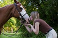 Pretty woman bonding with her horse Royalty Free Stock Photo