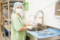 Pretty woman cleaning medical tools Royalty Free Stock Photo