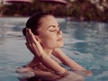 pretty woman with closed eyes Swimming in the pool nature enjoyment