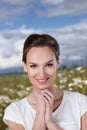 Pretty woman on a daisies meadow Royalty Free Stock Photo