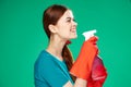 pretty woman with detergent cleaning service green background